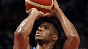 Greece's Giannis Antetokounmpo plays the ball during the FIBA Eurobasket 2022 quarter-final basketball match between Germany and Greece in Berlin, Germany, on September 13, 2022. 
Oliver Behrendt / AFP
