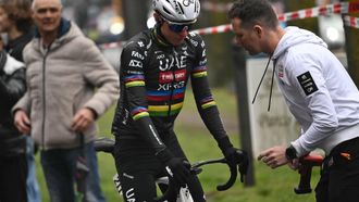 A mechanic checks the bike of Team UAE's Slovenian rider Tadej Pogacar, before the start of the Milan - Sanremo one-day classic cycling race, in Pavia, near Milan, on March 22, 2025. 
Marco BERTORELLO / AFP