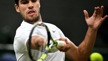 Spain's Carlos Alcaraz returns the ball to USA's Tommy Paul during their men's singles quarter-finals tennis match on the ninth day of the 2024 Wimbledon Championships at The All England Lawn Tennis and Croquet Club in Wimbledon, southwest London, on July 9, 2024. 
Ben Stansall / AFP