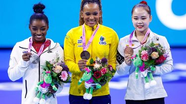 2023-10-07 15:48:49 (From L) Second-placed US' Simone Biles, winner Brasil's Rebeca Andrade and third-placed Korea's Seojeong Yeo celebrate on the podium after the Women's Vault Final during the 52nd FIG Artistic Gymnastics World Championships, in Antwerp, northern Belgium, on October 7, 2023. 
KENZO TRIBOUILLARD / AFP