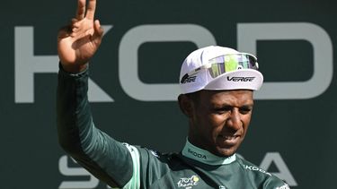 Intermarche - Wanty team's Eritrean rider Biniam Girmay celebrates on the podium with the best sprinter's green jersey after the 16th stage of the 111th edition of the Tour de France cycling race, 188,6 km between Gruissan and Nimes, southern France, on July 16, 2024. 
Marco BERTORELLO / AFP