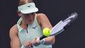 epa11825277 Suzan Lamens of Netherlands in action during the Women's round 2 match against Belinda Bencic of Switzerland at the Australian Open tennis tournament in Melbourne, Australia, 15 January 2025.  EPA/ROLEX DELA PENA