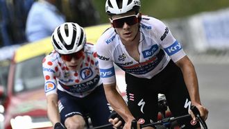 Soudal Quick-Step team's Belgian rider Remco Evenepoel wearing the best young rider's white jersey (R) cycles ahead of Team Visma - Lease a Bike team's Danish rider Jonas Vingegaard wearing the climber's polka dot (dotted) jersey (second placed in the category) in the ascent of Isola 2000 during the 19th stage of the 111th edition of the Tour de France cycling race, 144,6 km between Embrun and Isola 2000, in the French Alps, on July 19, 2024. 
Marco BERTORELLO / AFP