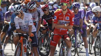 epa13198278 Slovenian rider Tadej Pogacar of team UAE Team Emirates XRG (R) wearing the overall leader's red jersey and British rider Oscar Onley of team Netcompany INEOS (L) wearing the youth leader's white jersey wait for the start to the 8th stage of the La Vuelta a Espana cycling tour, a race over 176.4km from Pucol to Xeraco, Spain, 29 August 2026.  EPA/Javier Lizon