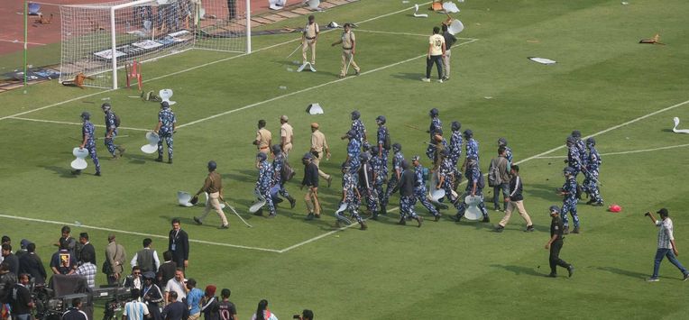epa12588676 Riot control police are seen after angry Lionel Messi fans turned violent, throwing bottles and chairs and vandalising hoardings at Salt Lake Stadium in Kolkata, West Bengal, India, 13 December 2025. Following Messi’s brief five-minute appearance, unrest broke out among fans who had paid a significant amount but were unable to see the Argentine football legend.  EPA/PIYAL ADHIKARY