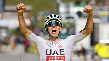 epa11452543 Slovenian rider Tadej Pogacar of UAE Team Emirates celebrates as he crosses the finish line to win the fourth stage of the 2024 Tour de France cycling race over 139km from Pinerolo to Valloire, France, 02 July 2024.  EPA/KIM LUDBROOK