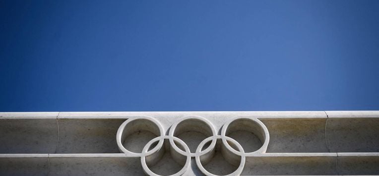 The Olympic Rings logo is pictured in front of the headquarters of the International Olympic Committee (IOC) in Lausanne on March 18, 2020, as doubts increase over whether Tokyo can safely host the summer Games amid the spread of the COVID-19. Olympic chiefs acknowledged on March 18, 2020 there was no 