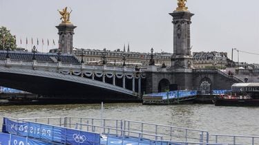 This photograph shows infrastructure on the venue of the swimming portion of the Paris 2024 Olympic Games triathlon, next to the Alexandre III bridge, on July 30, 2024. The Paris Olympics men's triathlon was postponed just hours before it was due to get under way on July 30 after water quality tests on the River Seine revealed it was still too dirty for swimming, organisers said.
Thibaud MORITZ / AFP