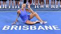 Belarus' Aryna Sabalenka celebrates with the trophy after defeating Russia's Polina Kudermetova in their women's singles final match at the Brisbane International tennis tournament on Pat Rafter Arena in Brisbane on January 5, 2025. 
William WEST / AFP