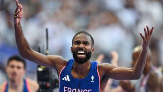 France's Muhammad Abdallah Kounta reacts after competing in the mixed 4x400m relay heat of the athletics event at the Paris 2024 Olympic Games at Stade de France in Saint-Denis, north of Paris, on August 2, 2024. 
Andrej ISAKOVIC / AFP