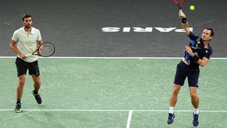 Netherlands' Wesley Koolhof (R) serves next to Croatia's Nikola Mektic (L) as they play against England's Lloyd Glasspool and Czechia's Adam Pavlasek during their men's doubles final match on day seven of the Paris ATP Masters 1000 tennis tournament at the Accor Arena - Palais Omnisports de Paris-Bercy - in Paris on November 3, 2024. 
Dimitar DILKOFF / AFP