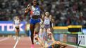 2023-08-19 21:58:57 USA's Alexis Holmes runs past Netherlands' Femke Bol who fell before the finish line in the mixed 4x400m relay final during the World Athletics Championships at the National Athletics Centre in Budapest on August 19, 2023. 
Jewel SAMAD / AFP