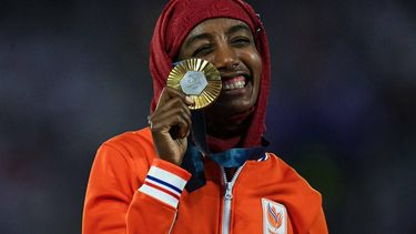 Gold medallist Netherlands' Sifan Hassan celebrates during the podium ceremony for the women's marathon of the athletics event during the closing ceremony of the Paris 2024 Olympic Games at the Stade de France, in Saint-Denis, in the outskirts of Paris, on August 11, 2024. 
Oli SCARFF / AFP