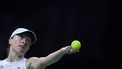 Poland's Iga Swiatek serves to Italy's Jasmine Paolini during their semi-finals singles tennis match between Poland and Italy at the Billie Jean King Cup Finals at the Palacio de Deportes Jose Maria Martin Carpena arena in Malaga, southern Spain, on November 18, 2024.
 
JORGE GUERRERO / AFP