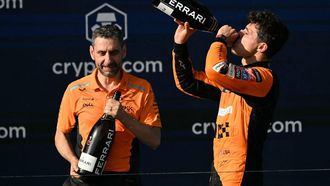 McLaren's British driver Lando Norris (R) celebrates on the podium with McLaren's Italian team principal Andrea Stella after winning the 2024 Miami Formula One Grand Prix at Miami International Autodrome in Miami Gardens, Florida, on May 5, 2024.  
Jim WATSON / AFP