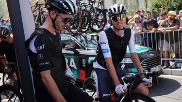 2023-07-08 12:09:17 epa10733773 Slovenian rider Tadej Pogacar (R) of team UAE Team Emirates and teammate British rider Adam Yates (L) look on before the start of the 8th stage of the Tour de France 2023, a 201km race from Libourne to Limoges, France, 08 July 2023.  EPA/MARTIN DIVISEK