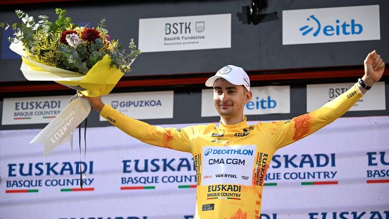 Team Decathlon CMA CGM's French rider Paul Seixas, the overall race leader and winner of the fifth stage of the Basque Country's Itzulia cycling tour, a 176.2 km race starting and finishing in Eibar, celebrates on the podium on April 10, 2026.  
ANDER GILLENEA / AFP