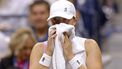 Poland's Iga Swiatek sits between games as she plays against USA's Jessica Pegula during their women's quarterfinals match on day ten of the US Open tennis tournament at the USTA Billie Jean King National Tennis Center in New York City, on September 4, 2024. 
Kena Betancur / AFP