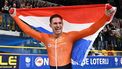 First placed Netherlands' Harrie Lavreysen celebrates with a Dutch flag after winning gold in the final round of the Men's Keirin race during the fifth day of the UEC European Track Cycling Championships at the Omnisport indoor arena in Apeldoorn, on January 14, 2024. 
JOHN THYS / AFP
