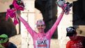 epa11372530 First-placed Tadej Pogacar of Uae Team EmiratesÂ poses on the podium after the Giro d'Italia 2024 cycling tour, in Rome, Italy, 26 May 2024.  EPA/GIUSEPPE LAMI