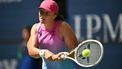 Poland's Iga Swiatek plays against Russia's Kamilla Rakhimova during their women's singles first round match on day two of the US Open tennis tournament at the USTA Billie Jean King National Tennis Center in New York City, on August 27, 2024. 
ANGELA WEISS / AFP