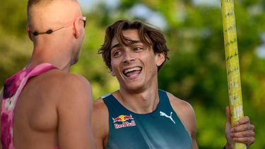 Sweden's Armand Duplantis (R) reacts with US' Sam Kendricks during the men's pole vault city event part of the 