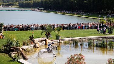 epa11503032 Janneke Boonzaaijer of the Netherlands jumps over a course obstacle with her horse Champ de Tailleur during the Eventing Cross Country Team and Individual competition of the Equestrian Eventing competitions in the Paris 2024 Olympic Games, at the Chateau de Versailles in Versaille, France, 28 July 2024.  EPA/TOLGA AKMEN