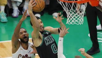 epa11343563 Boston Celtics forward Jayson Tatum (R) drives to the basket past Cleveland Cavaliers forward Evan Mobley (L) during the second half of the NBA Eastern Conference Semifinal game five between the Boston Celtics and the Cleveland Cavaliers in Boston, Massachusetts, USA, 15 May 2024. The Celtics advance to the NBA Eastern Conference Finals after beating the Cavaliers in the best of seven series 4-1.  EPA/CJ GUNTHER  SHUTTERSTOCK OUT