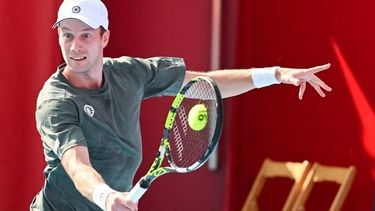 Netherlands' Botic Van De Zandschulp hits a return against China’s Shang Juncheng during their men's singles match at the Hong Kong Open tennis tournament in Hong Kong on January 3, 2024. 
Peter PARKS / AFP