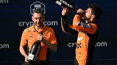 McLaren's British driver Lando Norris (R) celebrates on the podium with McLaren's Italian team principal Andrea Stella after winning the 2024 Miami Formula One Grand Prix at Miami International Autodrome in Miami Gardens, Florida, on May 5, 2024.  
Jim WATSON / AFP