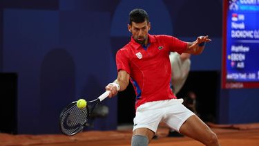 epa11499408 Novak Djokovic of Serbia in action during his Men's Singles first round match against Matthew Ebden of Australia at the Tennis competitions in the Paris 2024 Olympic Games, at the Roland Garros in Paris, France, 27 July 2024.  EPA/DIVYAKANT SOLANKI