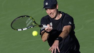 epa11950559 Botic Van de Zandschulp of the Netherlands in action against Novak Djokovic of Serbia during their men's second round match at the BNP Paribas Open tennis tournament in Indian Wells, California, USA, 08 March 2025.  EPA/JOHN G. MABANGLO