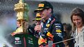 2023-07-09 17:55:16 Winner Red Bull Racing's Dutch driver Max Verstappen holding the trophy reacts as second placed McLaren's British driver Lando Norris sprays champagne during the podium ceremony for the Formula One British Grand Prix at the Silverstone motor racing circuit in Silverstone, central England on July 9, 2023. 
Ben Stansall / AFP
