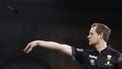 epa11031740 Kevin Doets of The Netherlands plays against Michael Smith of England (not pictured) during the opening session of the Paddy Power World Darts Championship at Alexandra Palace in London, Britain, 15 December 2023.  EPA/TOLGA AKMEN