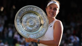 Czech Republic's Linda Noskova poses with the winner's trophy, the Venus Rosewater Dish, after winning against Czech Republic's Karolina Muchova during their women's singles final tennis match on the thirteenth day of the 2026 Wimbledon Championships at The All England Lawn Tennis and Croquet Club in Wimbledon, southwest London, on July 11, 2026. 
Adrian Dennis / AFP