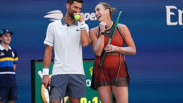 Serbia's Novak Djokovic and Belarus's Aryna Sabalenka speak with each other during their mixed doubles tennis match against Czech Republic's Katerina Siniakova and Britain's Henry Patten during Fan Week as part of the 2026 US Open tennis tournament at the USTA Billie Jean King National Tennis Center in New York, on August 25, 2026. 
TIMOTHY A. CLARY / AFP