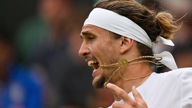 Germany's Alexander Zverev reacts as he returns the ball to Britain's Cameron Norrie during their men's singles tennis match on the sixth day of the 2024 Wimbledon Championships at The All England Lawn Tennis and Croquet Club in Wimbledon, southwest London, on July 6, 2024. 
ANDREJ ISAKOVIC / AFP