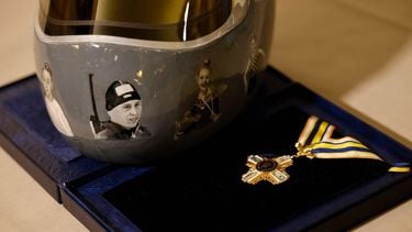 Ukrainian skeleton athlete Vladyslav Heraskevych's helmet is pictured next to a medal during a meeting with Heraskevych and Ukrainian President Volodymyr Zelensky in Munich, southern Germany, on the sidelines of the 62nd Munich Security Conference (MSC) on February 13, 2026. Heraskevych was barred from the Milan-Cortina Games after refusing to back down from wearing a helmet adorned with pictures of Ukrainian sportsmen and women killed since Russian invaded in 2022.
Alexandra BEIER / AFP