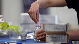 An attendee handles the sampling equipment during a training for doping controllers who came to train for the Paris Olympic and Paralympic Games in Saint-Denis, north of Paris, on April 22, 2023. These 33 trainees responded this winter to a classified ad from the International Control Agency (ICA), which manages the Olympic anti-doping program on behalf of the International Olympic Committee (IOC).
FRANCK FIFE / AFP