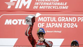 epa11644728 Ducati Lenovo rider Francesco Bagnaia of Italy (C) celebrates on the podium after winning the MotoGP race of the Motorcycling Grand Prix of Japan in Motegi, north of Tokyo, Japan, 06 October 2024.  EPA/FRANCK ROBICHON