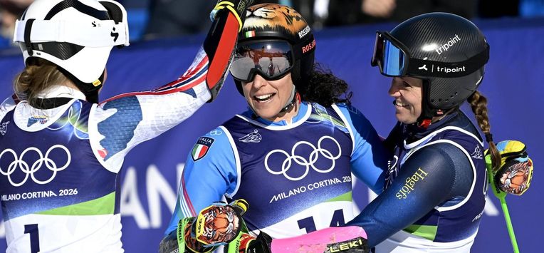 epa12742767 Winner Federica Brignone (C) of Italy is congratulated by second placed Sara Hector (R) of Sweden and third placed Thea Louise Stjernesund of Norway after the 2nd run in the Women's Giant Slalom of the Alpine Skiing competitions at the Milano Cortina 2026 Winter Olympic Games, Tofane ski centre in Cortina d'Ampezzo, Italy, 15 February 2026.  EPA/DANIEL DAL ZENNARO