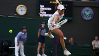 Poland's Iga Swiatek misses a return against Kazakhstan's Yulia Putintseva during their women's singles tennis match on the sixth day of the 2024 Wimbledon Championships at The All England Lawn Tennis and Croquet Club in Wimbledon, southwest London, on July 6, 2024. Putintseva won the third round match 3-6, 6-1, 6-2.
HENRY NICHOLLS / AFP