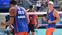 Netherlands' #01 Steven Van De Velde and Netherlands' #02 Matthew Immers celebrate a point in the men's pool B beach volleyball match between Netherlands and Chile during the Paris 2024 Olympic Games at the Eiffel Tower Stadium in Paris on July 31, 2024. 
Kirill KUDRYAVTSEV / AFP