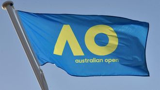 A flag carrying the new livery of the Australian Open tennis tournament flies in Melbourne on January 12, 2017. 
PAUL CROCK / AFP