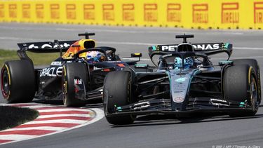 Mercedes' British driver George Russell (R) and Red Bull Racing's Dutch driver Max Verstappen (L) race during the 2025 Formula 1 Grand Prix du Canada at Circuit Gilles-Villeneuve in Montreal, Canada, on June 15, 2025.  
TIMOTHY A. CLARY / AFP