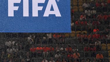 Rain falls in front of a FIFA logo before the start of the UEFA Euro 2024 semi-final football match between the Netherlands and England at the BVB Stadion in Dortmund on July 10, 2024. 
Kirill KUDRYAVTSEV / AFP