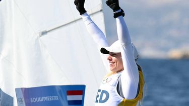 Netherlands' Marit Bouwmeester celebrates, as she is ensured to become gold medallist after race 10 of the women’s ILCA 6 single-handed dinghy event was cancelled during the Paris 2024 Olympic Games sailing competition at the Roucas-Blanc Marina in Marseille on August 5, 2024.  
Christophe SIMON / AFP