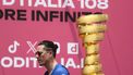 Groupama-FDJ's French rider David Gaudu walks past the Giro d'Italia trophy (“trofeo senza fine”) prior to the first stage of the 108th Giro d'Italia cycling race, 160km from Durres to Tirana in Albania, on May 9, 2025. 
Luca Bettini / AFP