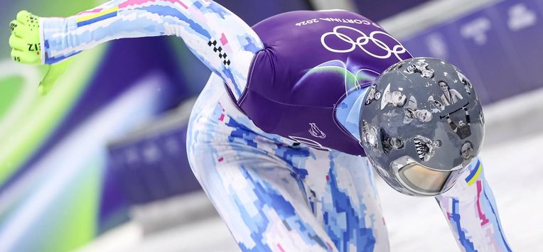 epa12726947 Vladyslav Heraskevych of Ukraine wears a helmet in memory of the Ukrainian athletes who died in the war during the Men's Skeleton training session at the Milano Cortina 2026 Winter Olympic Games, in Cortina d'Ampezzo, Italy, 11 February 2026.  EPA/ANDREA SOLERO