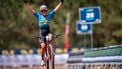 epa12265697 Jenny Rissveds of Sweden, 1st, crosses the finish line of the Cross Country Elite Women, XCO, European MTB Championship, in Melgaco, Portugal, 27 July 2025.  EPA/MAXIME SCHMID